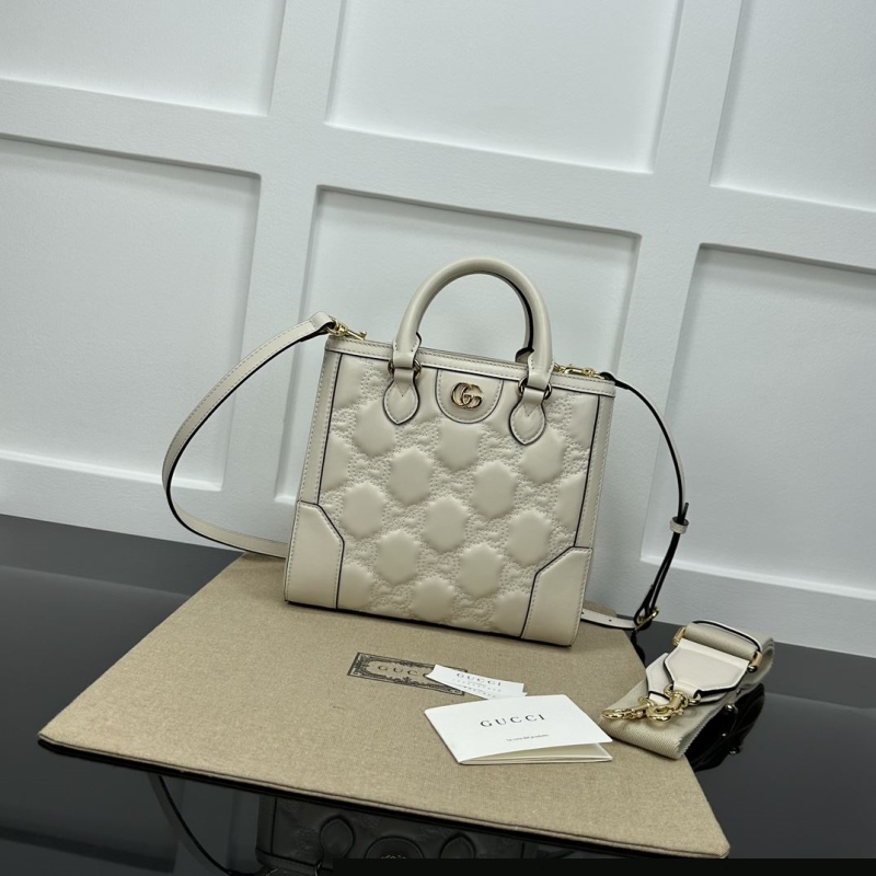 G*u*i top handle bags